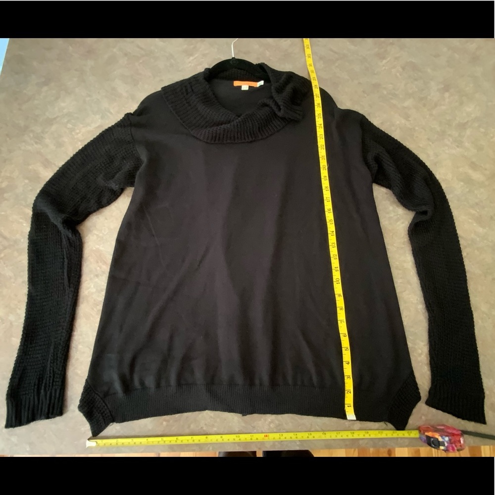 Long sleeve black sweater with sexy open back style